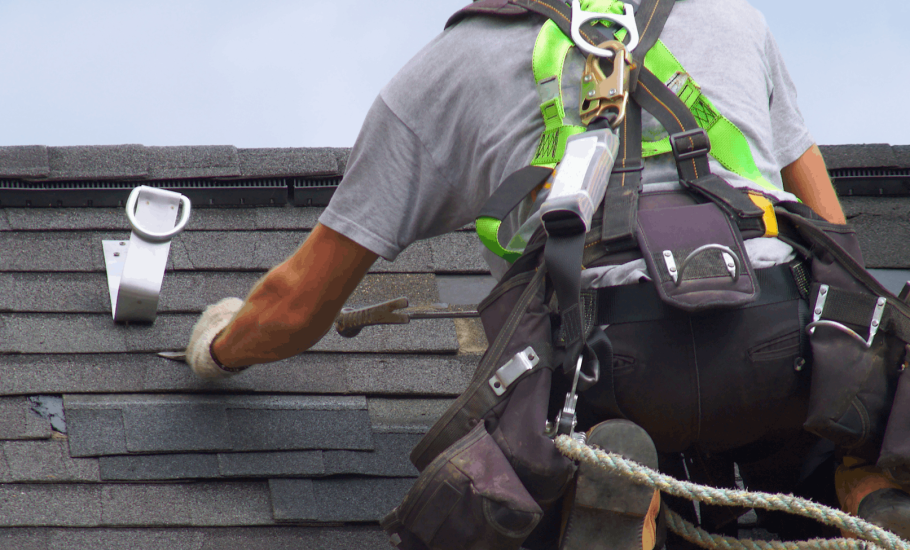 Construction worker doing roof repair
