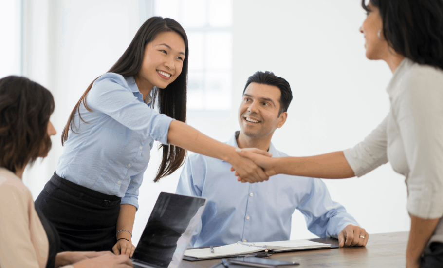 Woman shaking hands with a banker